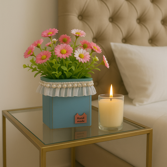Charming Faux Pink Daisy Arrangement in Lace-Trimmed Teal Pot with Scented Candle