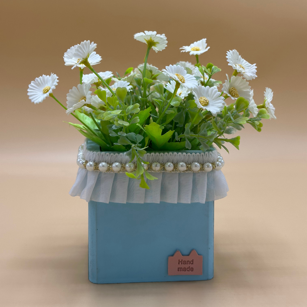 Charming Faux Pink Daisy Arrangement in Lace-Trimmed Teal Pot with Scented Candle